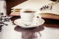 Coffee morning in the workplace. with a book or laptop. selective focus. Royalty Free Stock Photo