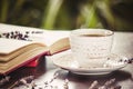 Coffee morning in the workplace. with a book or laptop. selective focus. Royalty Free Stock Photo