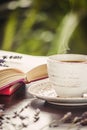 Coffee morning in the workplace. with a book or laptop. selective focus. Royalty Free Stock Photo