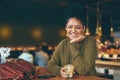 Coffee is the most important meal of the day. Portrait of an attractive young woman enjoying a cup of coffee in a cafe.