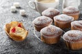 Coffee muffins on a wooden Board. Sweet muffins with berry filling on the table.