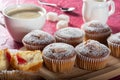 Coffee muffins on a wooden Board. Sweet muffins with berry filling on the table. Royalty Free Stock Photo