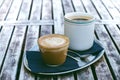 Coffee mug and cake on a wooden vintage table. Hipster concept. Woman drink a coffee. Cups of americano and macchiato. Royalty Free Stock Photo