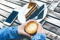 Coffee mug and cake on a wooden vintage table. Hipster concept. Woman drink a coffee. Cups of americano and macchiato. Royalty Free Stock Photo