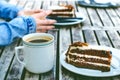 Coffee mug and cake on a wooden vintage table. Hipster concept. Woman drink a coffee. Cups of americano and macchiato. Royalty Free Stock Photo