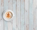 Coffee mug with christmas tree on white wood table