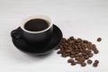 Coffee mug and coffee breans on wood backgound Royalty Free Stock Photo