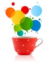 Coffee-mug with colorful abstract speech bubble Royalty Free Stock Photo