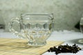 Coffee mug is empty, placed on a bamboo coaster. There was a spoon with tea leaves next to it. the back is the background very Royalty Free Stock Photo