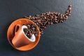Coffee mug espresso spilled beans Royalty Free Stock Photo