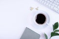 Fly lying, top view office desk with laptop, notepad, coffee, leaves with copy space on a white background