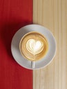 Coffee Mug on Wooden Table. Top view cup of coffee on wooden table. Close up hot coffe in white cup on wood table. Coffee latte Royalty Free Stock Photo