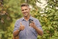 Coffee is my best friend. Happy man give thumbs up drinking coffee. Gesturing thumbs up hand sign. Thumbs up gesture Royalty Free Stock Photo