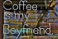 `Coffee is my boyfriend` written at the entrance of a traditional cafeteria.