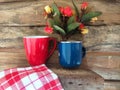 Coffee, napkin and flower on wood background