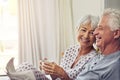 Coffee, newspaper and a senior couple in bed, enjoying retirement in their home in the morning. Tea, reading or love Royalty Free Stock Photo