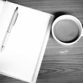 Coffee and notebook black and white color tone style Royalty Free Stock Photo