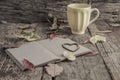 Coffee and notebook on wooden table decorated with autumn leaves Royalty Free Stock Photo