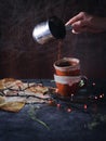 Pouring coffee over a dark backdrop in a nostalgic scene