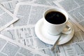 Coffee over newspaper Royalty Free Stock Photo