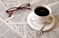 Coffee over newspaper Royalty Free Stock Photo