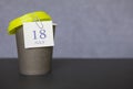 Coffee paper cup with calendar dates for July 18, Summer season. Time for relaxing breaks and vacations