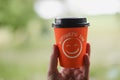 Coffee paper cup with a have a nice day message. Good morning, motivation concept Royalty Free Stock Photo