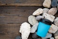 Coffee paper cups and sea pebbles stone