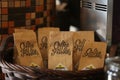 Coffee paper packaging sample in a wooden basket for sale