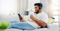 Coffee, phone and happy man on sofa with headphones for social media, video streaming service and networking mobile app Royalty Free Stock Photo