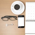 Coffee and phone with key,eyeglasses,notepad,calendar vintage st Royalty Free Stock Photo