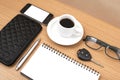 Coffee and phone with notepad,car key,eyeglasses and wallet Royalty Free Stock Photo