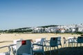 Coffee place with white chairs and table in a small town in southern spain, at the seaside of the mediterranean Royalty Free Stock Photo