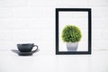 Coffee and plant inside frame Royalty Free Stock Photo