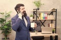 Coffee is pledge of successful negotiations. Caffeine addicted. Man bearded businessman hold cup and smartphone. Mobile