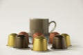 Coffee pods with espresso cup on white background Royalty Free Stock Photo