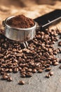 Coffee portafilter with coffee beans. Stone background Royalty Free Stock Photo