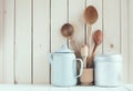 Coffee pot, enamel mugs and rustic spoons