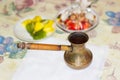 Coffee pot with freshly brewed Turkish coffee on a table Royalty Free Stock Photo