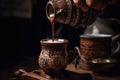 Coffee poured from a cezve into a cup. Pouring Turkish coffee close up from a decorated coffee cup, AI Generated Royalty Free Stock Photo