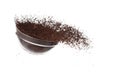 Coffee powder fall down pour in glass bowl, Coffee crushed float explode, abstract cloud fly. Coffee dust powder splash throwing