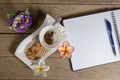 Coffee powder and sugar in cup with cookies,open notebook Royalty Free Stock Photo