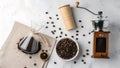 Coffee Preparation Setup With Beans, Grinder, and Brewing Equipment on a Light Surface Highlighting the Art of Coffee Making Royalty Free Stock Photo