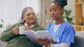 Coffee, reading book or senior patient with nurse on sofa for nursing home, retirement or house. Healthcare, tea or Royalty Free Stock Photo