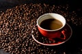 Coffee in red cup and coffee beans are the background. Royalty Free Stock Photo