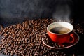 Coffee in red cup and coffee beans are the background. Royalty Free Stock Photo