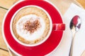 Coffee red cup on wood table in cafe