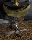 Coffee roaster machine at coffee roasting process. Mixing coffee beans