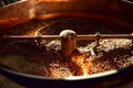 Coffee roasting machine. Coffee beans in the chafing dish. Royalty Free Stock Photo