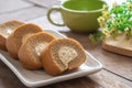 Coffee roll cake with cream on plate and coffee cup Royalty Free Stock Photo